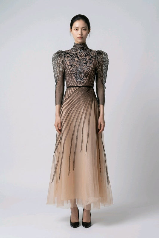 Woman wearing a long, elegant dress with intricate detailing.