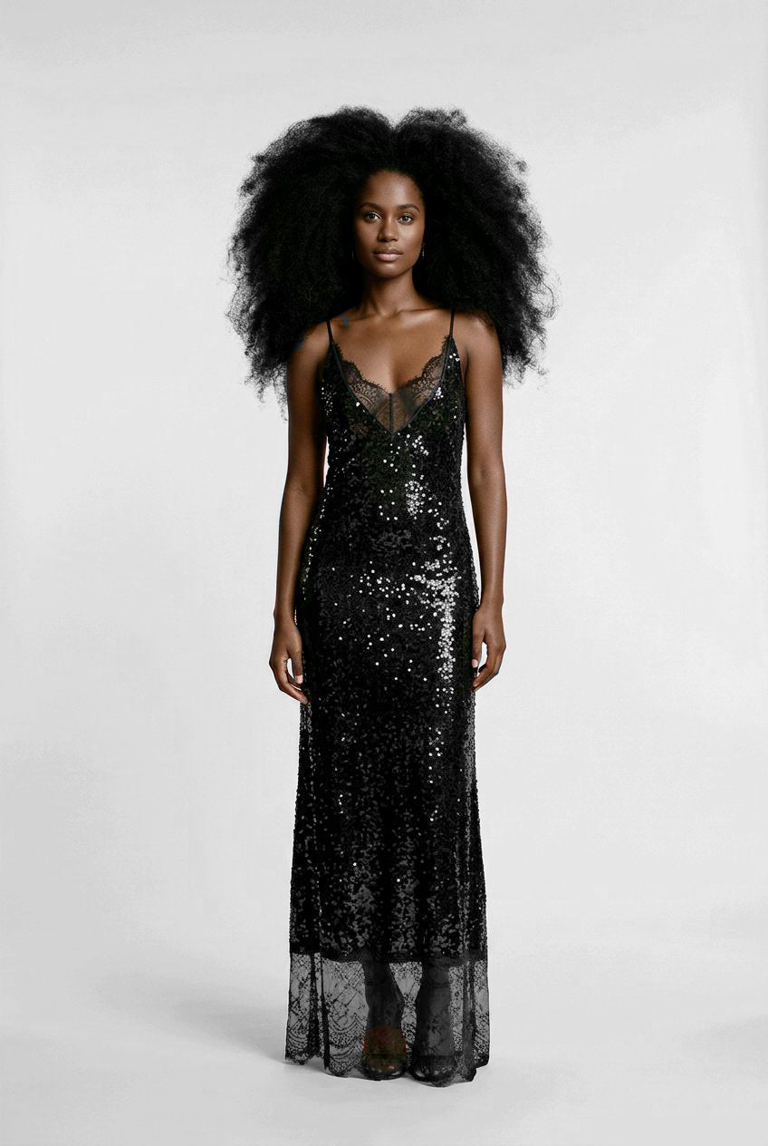 Woman wearing a black sequin dress.