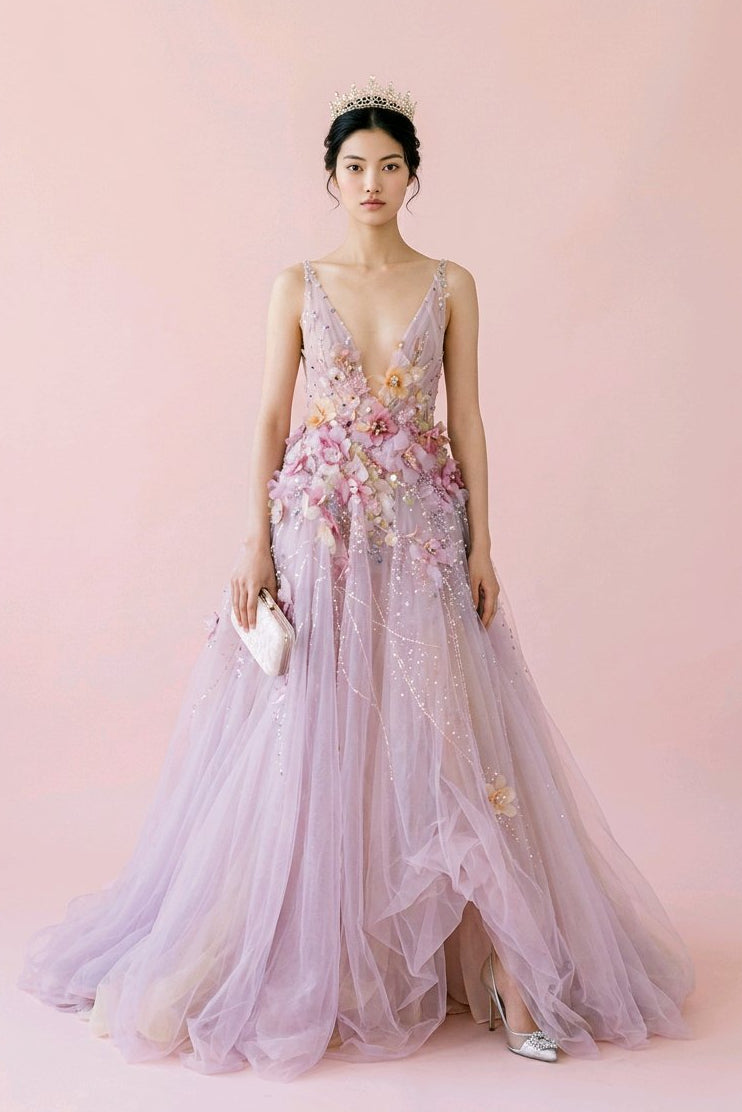 Woman wearing a floral pink gown against.
