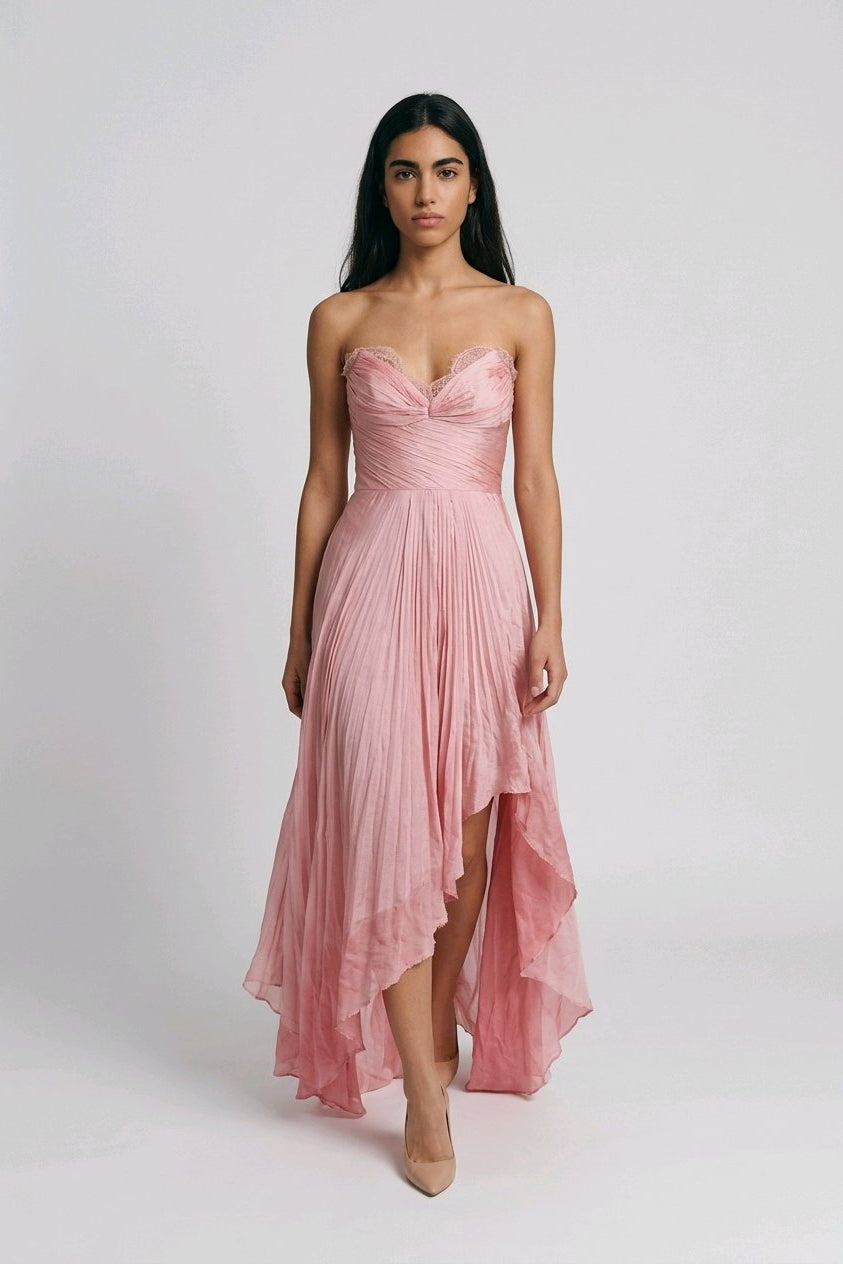 Woman wearing a pink strapless dress.
