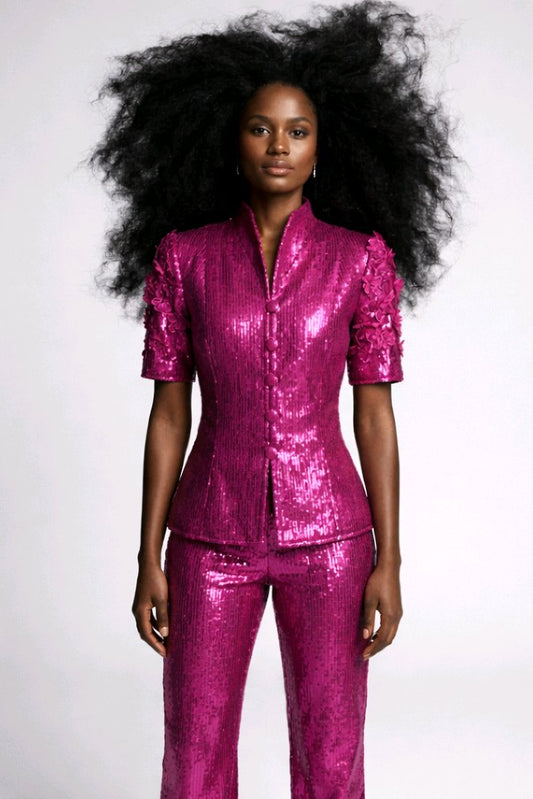 Woman wearing a shiny pink outfit.