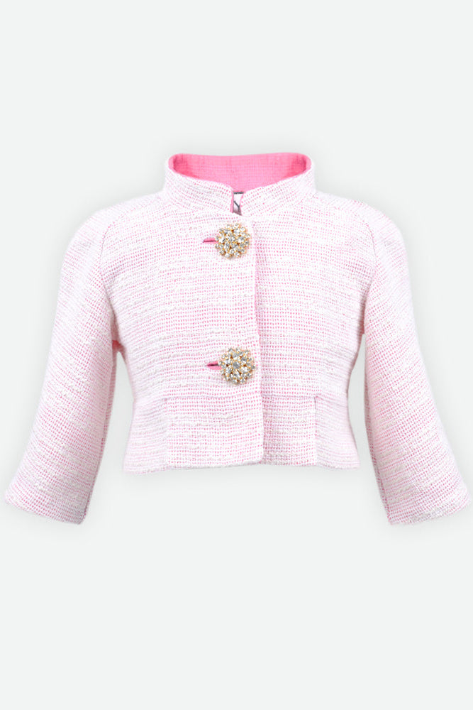 A light pink tweed jacket with a high stand collar, long sleeves, and two decorative crystal-embellished buttons.